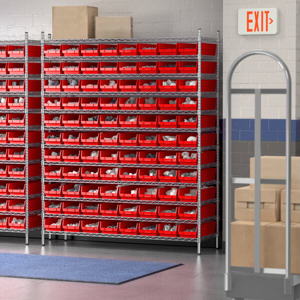 A Regency wire shelving unit with red bins on storage shelves.