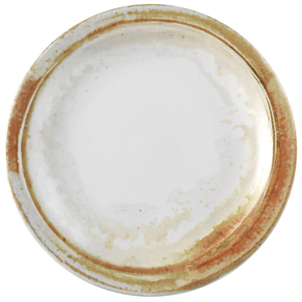 A white Dudson Maker's Finca china plate with a brown rim.