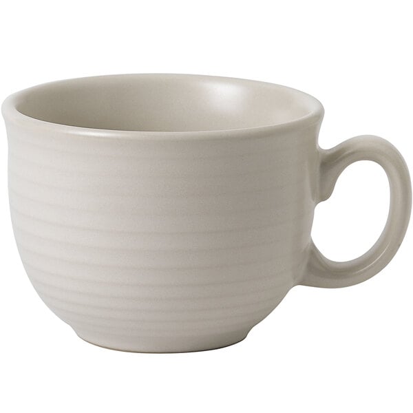 a close-up of a white coffee cup