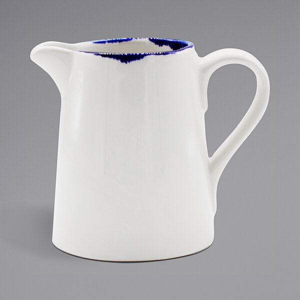 a white and blue pitcher