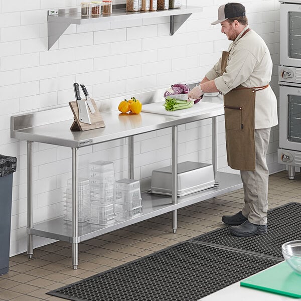 a man in a brown apron cutting vegetables