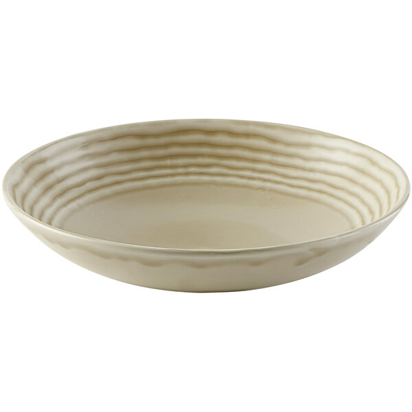 A white Dudson Harvest Norse china bowl with a pattern on it and a curved edge.