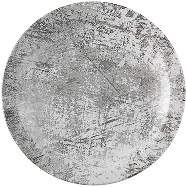 A white plate with black specks.