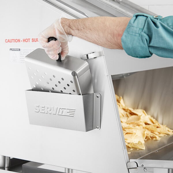 a person holding a fryer