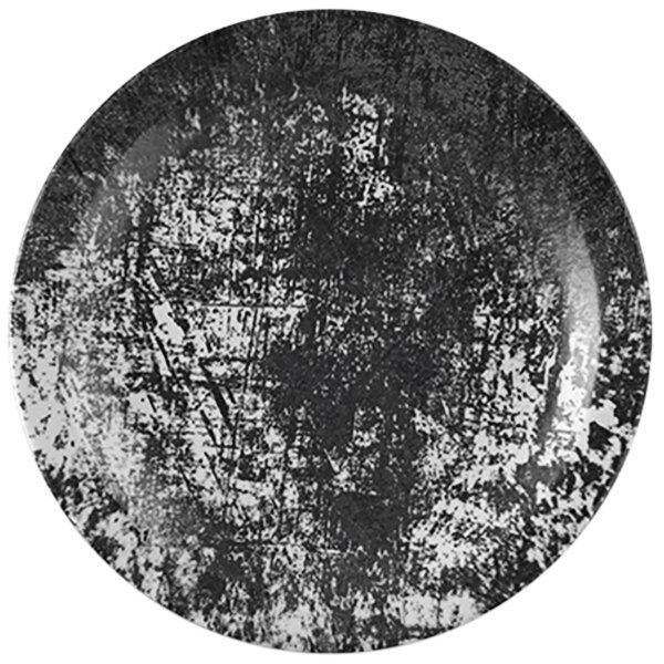 A close-up of a Dudson Maker's Urban black and white china plate with a grunge texture.