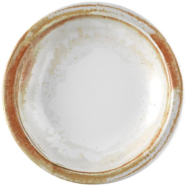 A white Dudson Maker's Finca china bowl with brown spots on the rim.