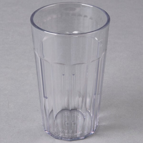 A clear Cambro plastic tumbler with a small hole in the middle.
