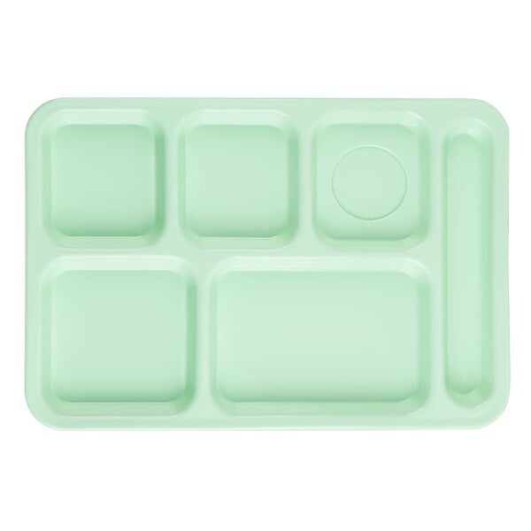 A close-up of a green rectangular Carlisle 6 compartment tray.
