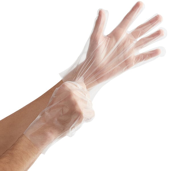 A person wearing a small clear plastic CPE glove.