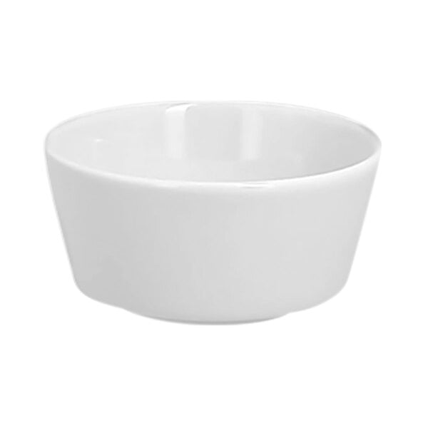 A small round white porcelain butter ramekin.