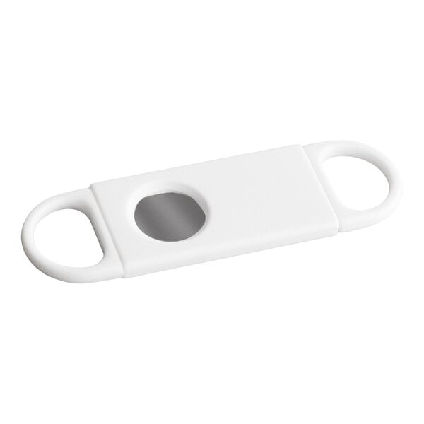 A white rectangular object with two circular handles and a central oval opening revealing a metal blade.