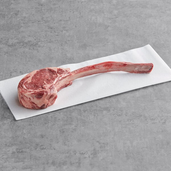 Raw tomahawk steak