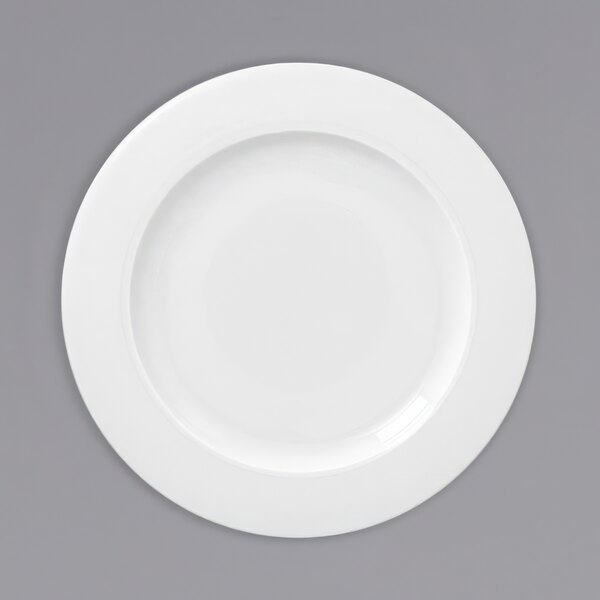 A white plate with a white rim.