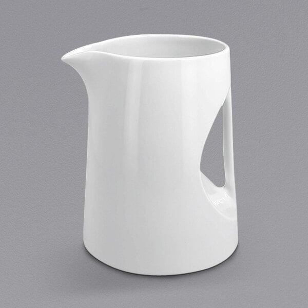 A white RAK Porcelain pitcher with a handle.