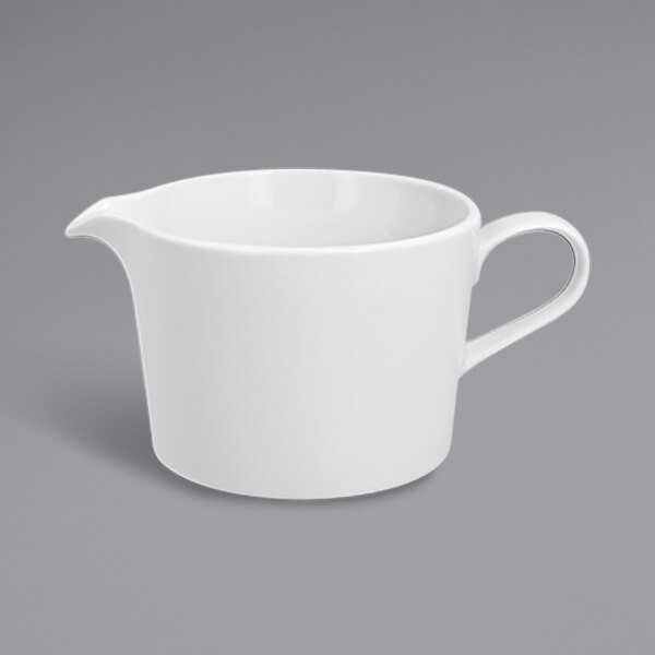 A white RAK Porcelain gravy boat with a handle.