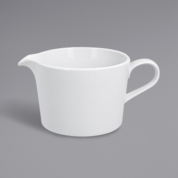 A white RAK Porcelain gravy boat with a handle.