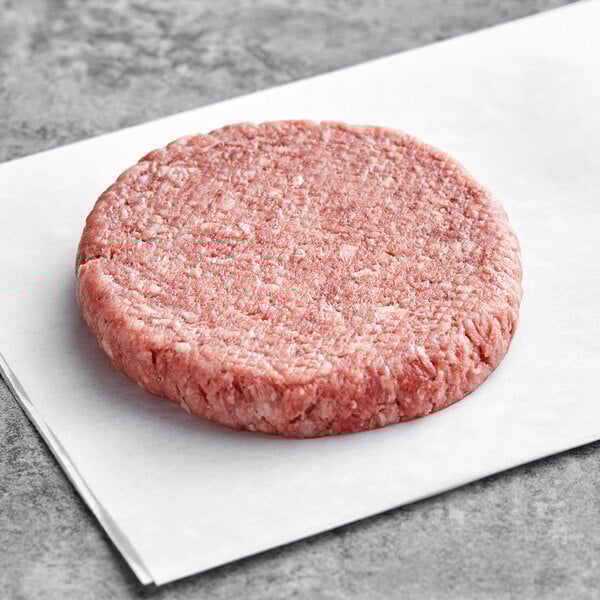 A raw Rastelli's American Wagyu burger on white paper.