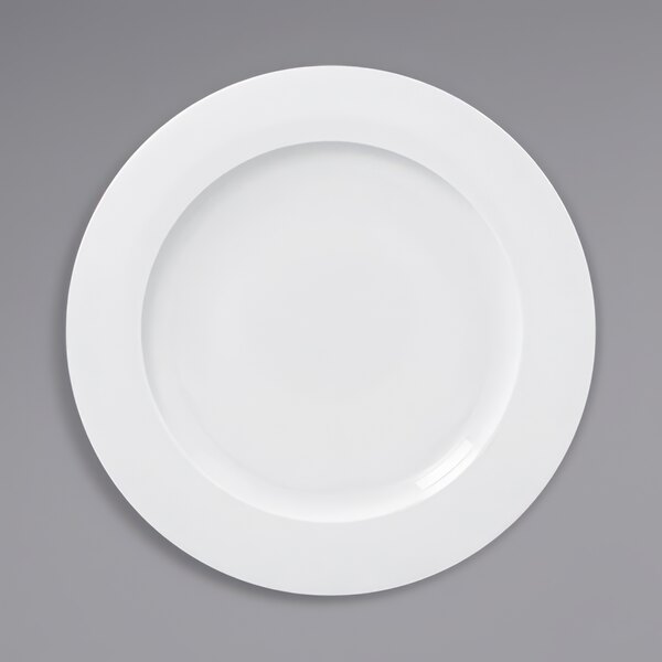 A white RAK Porcelain flat plate with a circular edge.