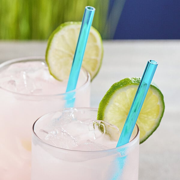 Two glasses with ice, lime slices, and Franmara blue acrylic straws.