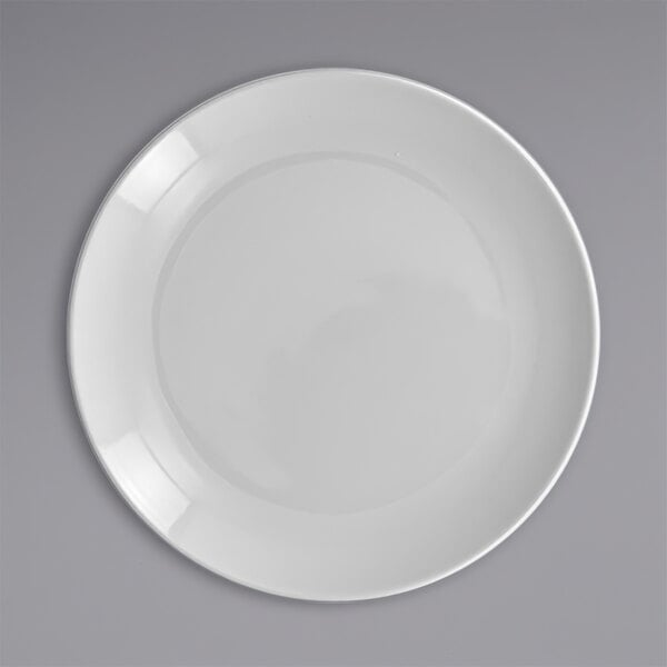 A RAK Porcelain Polaris Orion white porcelain plate on a gray background.