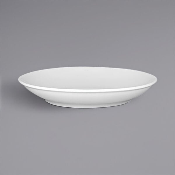 A white porcelain deep coupe plate with a black stripe on the rim.