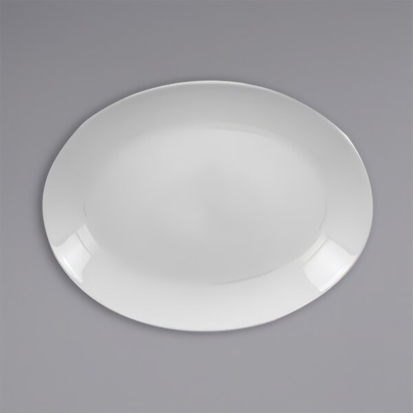 A white oval RAK Porcelain platter on a gray surface.