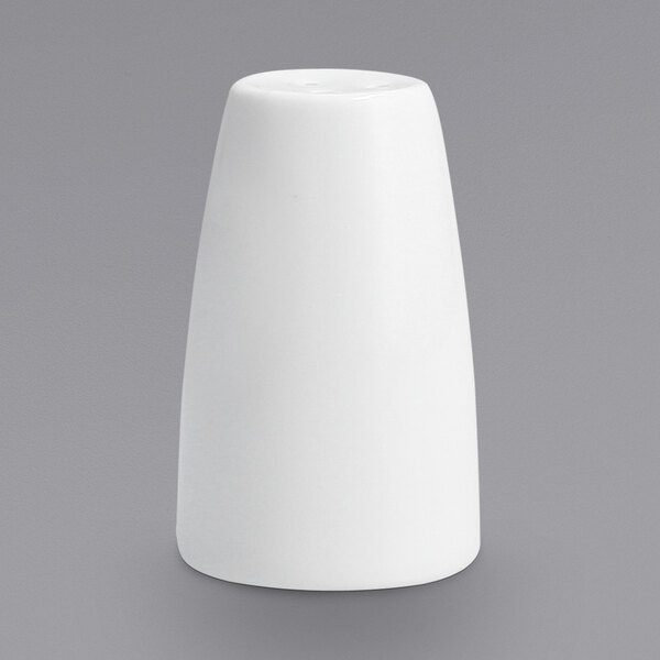 A white Fortessa porcelain pepper shaker on a gray background.