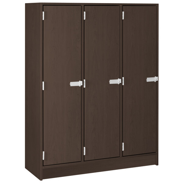 A brown locker with white handles and three doors.
