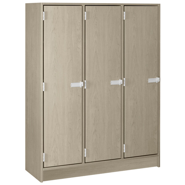 A natural elm wooden locker with three doors.