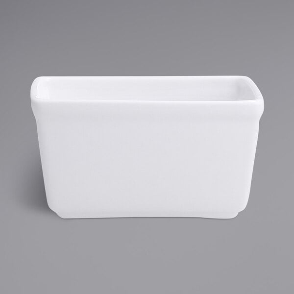 A white rectangular Fortessa porcelain sugar packet holder.