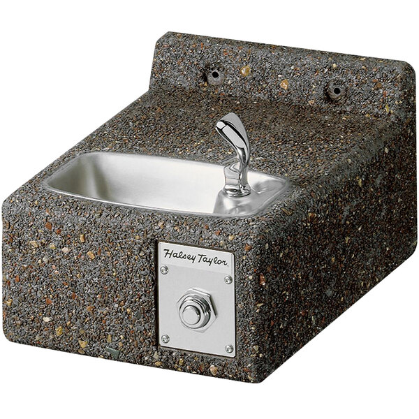 A Halsey Taylor outdoor wall mount drinking fountain with a silver faucet.