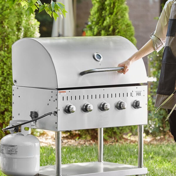 a person holding a grill