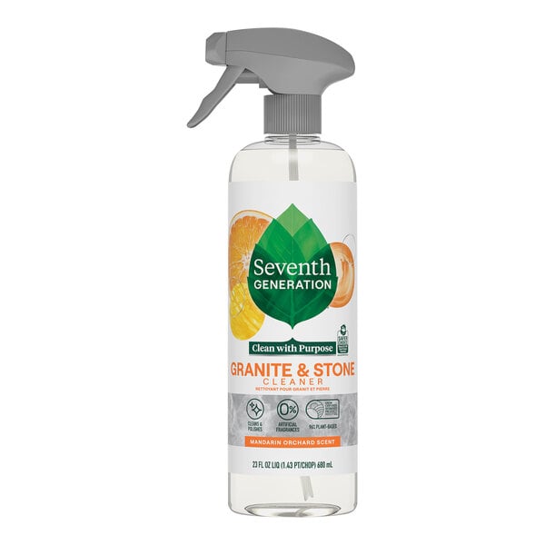 A Seventh Generation Mandarin Orchard Granite Cleaner spray bottle with a white label on a counter.