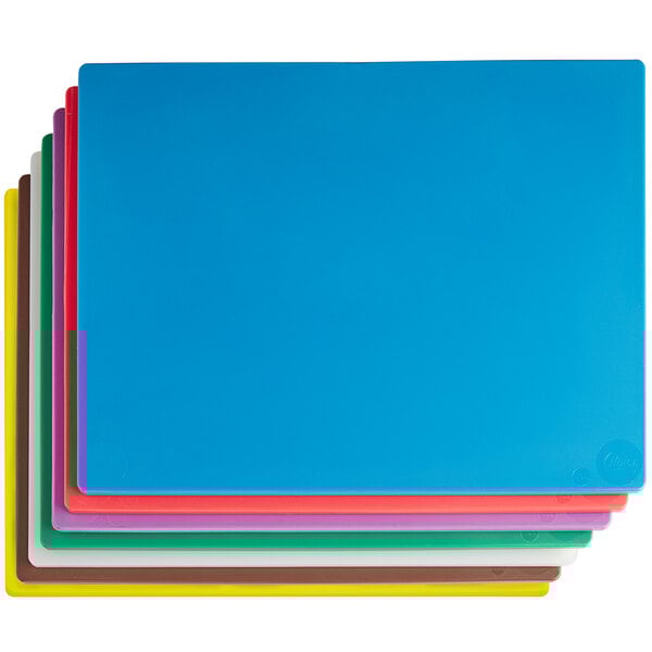 A group of colorful plastic cutting boards including blue and pink.