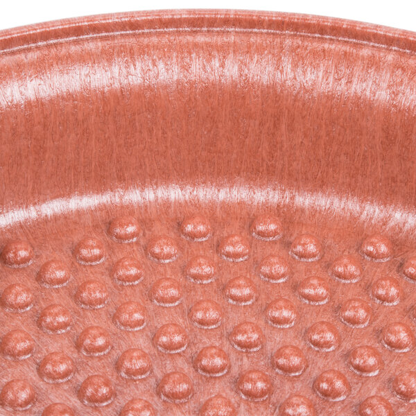 A close up of a red polyethylene tortilla server with small dots.