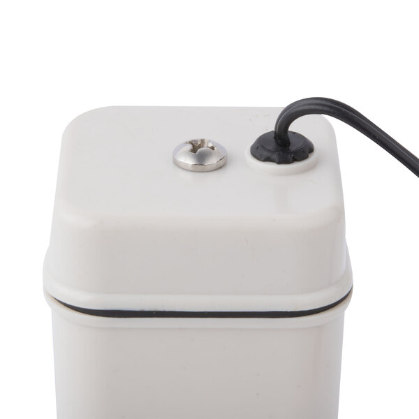 a white square object with a black cord