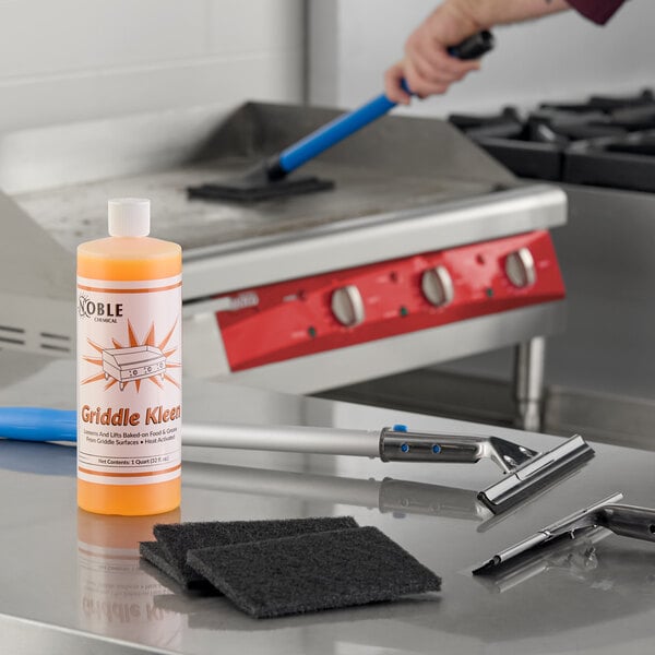 A griddle cleaning starter kit including a bottle of cleaner, scrubbing pads, and cleaning tools.