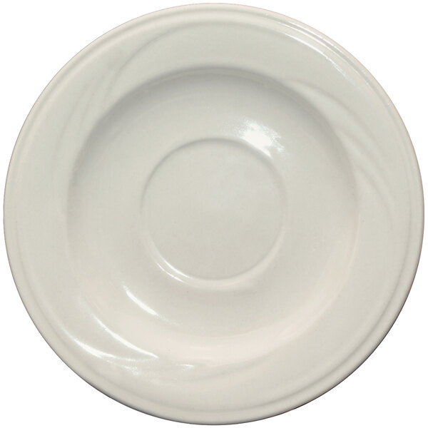 An ivory stoneware saucer with an embossed circular pattern.