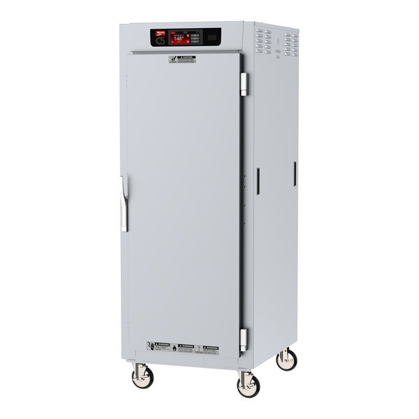 A stainless steel Metro C5 heated holding cabinet with full solid doors and wheels.