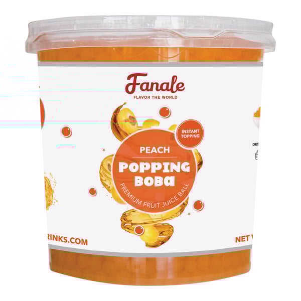 A plastic container of Fanale peach popping boba on a table.