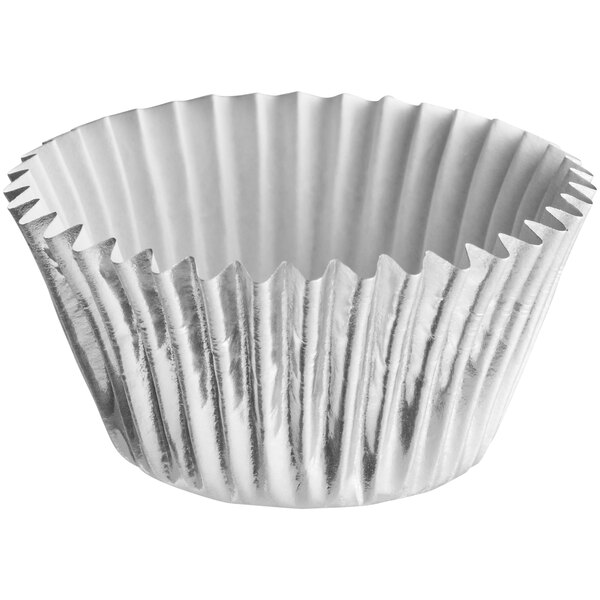 A white cupcake wrapper with a silver lining.