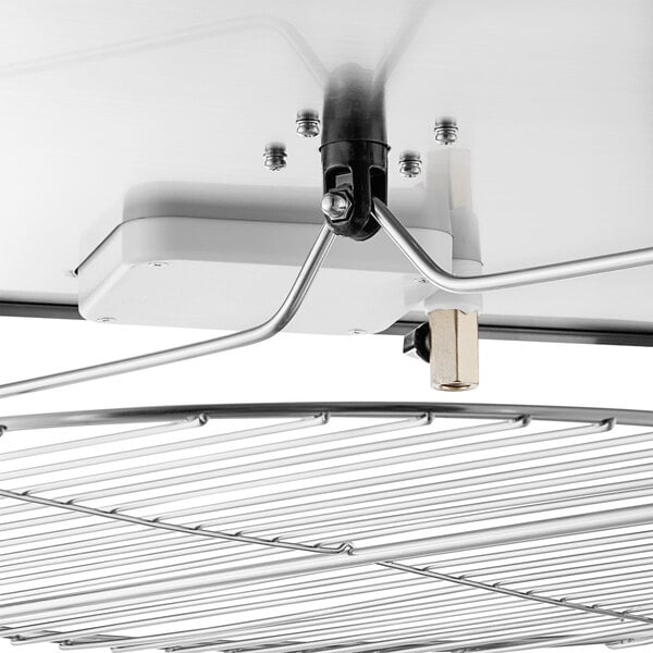 A metal shelf with a wire attached to it in a ServIt countertop pizza warmer.