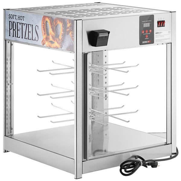 A metal countertop food warmer with a glass door.