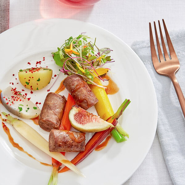 A plate of food with Shaffer Venison Farms Venison Sausage, vegetables, and a fork.