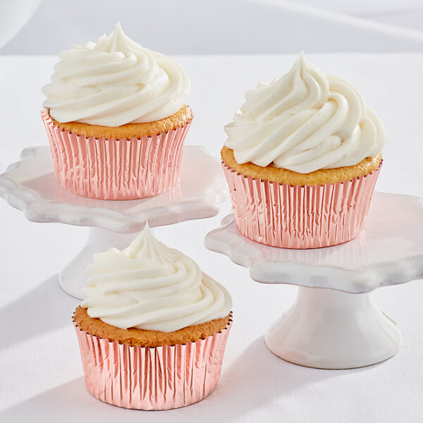 a group of cupcakes with white frosting