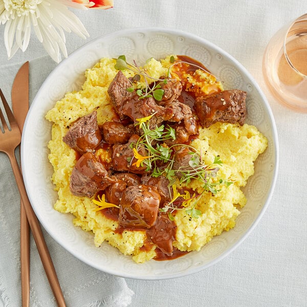 A bowl of Shaffer Venison Farms water buffalo stew meat with a fork.