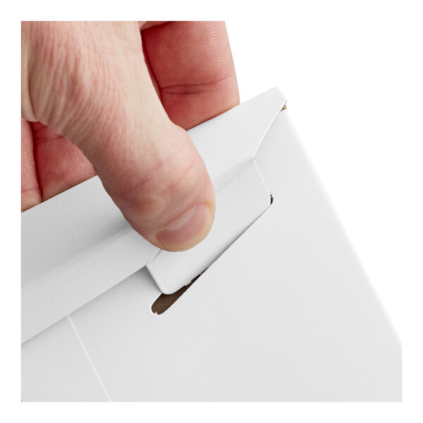 A close-up of a hand closing a white tab-locking rigid mailer.