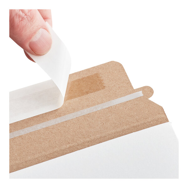 A white self-sealing rigid mailer with a peel-and-seal adhesive strip being opened.