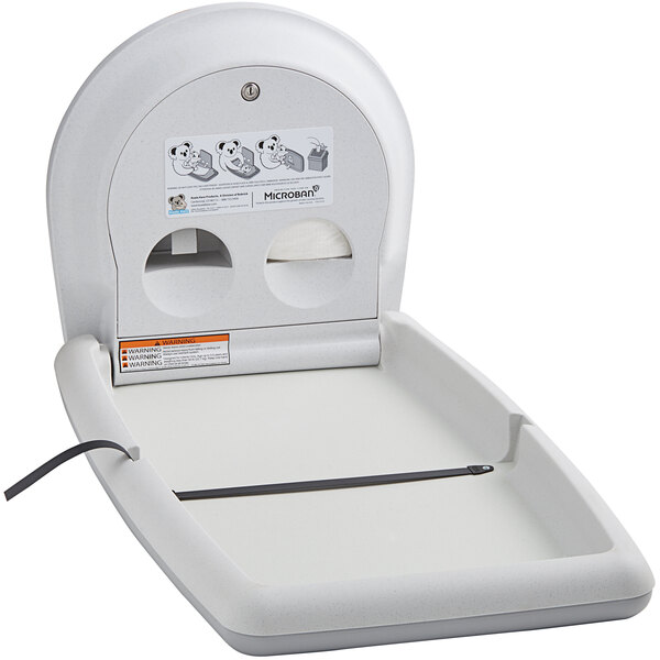 A Koala Kare white granite vertical surface-mounted baby changing table.