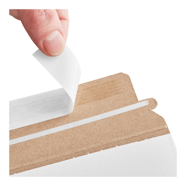A white self-sealing rigid mailer with a peel-and-seal adhesive strip being opened.